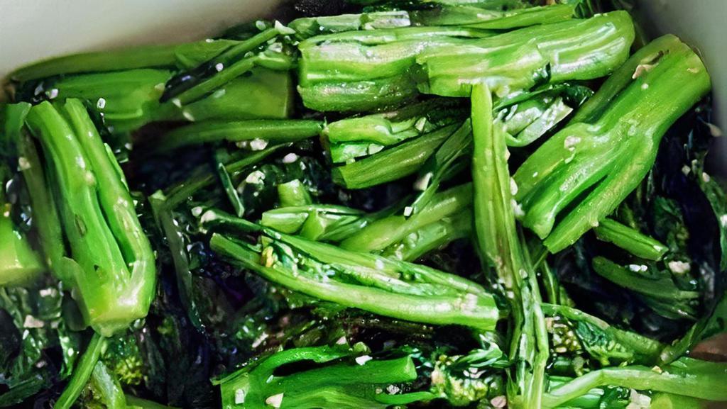 Wok-Fried Greens · Wok-fried yu choy, garlic, Thai chili, and soy.
Vegan and contains gluten.