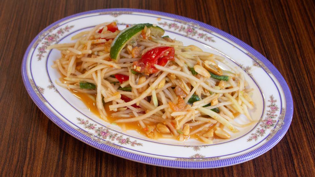 Papaya Salad · CONTAINS SHELLFISH AND PEANUTS. IT IS VERY SPICY. WE CANNOT MAKE IT LESS SPICY OR WITHOUT SHELLFISH (shrimp) OR PEANUTS. 

 Peanuts, dried shrimp, Thai chili, tomato, lime, and garlic.