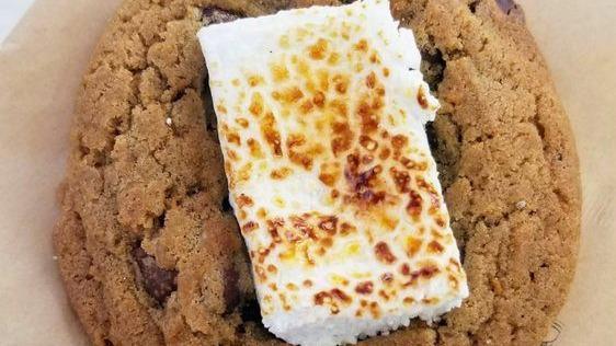 S'Mores · Our s'mores cookie is made with brown butter, graham cracker crumbs, cinnamon, and milk chocolate chips. Topped with a toasted house made marshmallow!