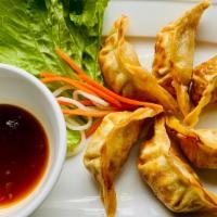 A 11 - Chicken Potstickers · Crispy chicken and vegetable potstickers (6 pcs) served with house onion soy sauce
