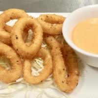 A 7 - Crispy Calamari Rings · Crispy calamari rings served with house creamy sriracha sauce