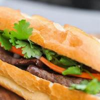 Pork Banh Mi · Charbroiled pork, pickled carrot and white radish, cucumber, jalapenos and cilantro and our ...