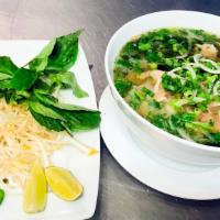 P 1 - Phở Đặt Biệt/ House Combination Pho · Combo beef pho with steak, flank, tendon, brisket served with bean sprout and basil on the s...