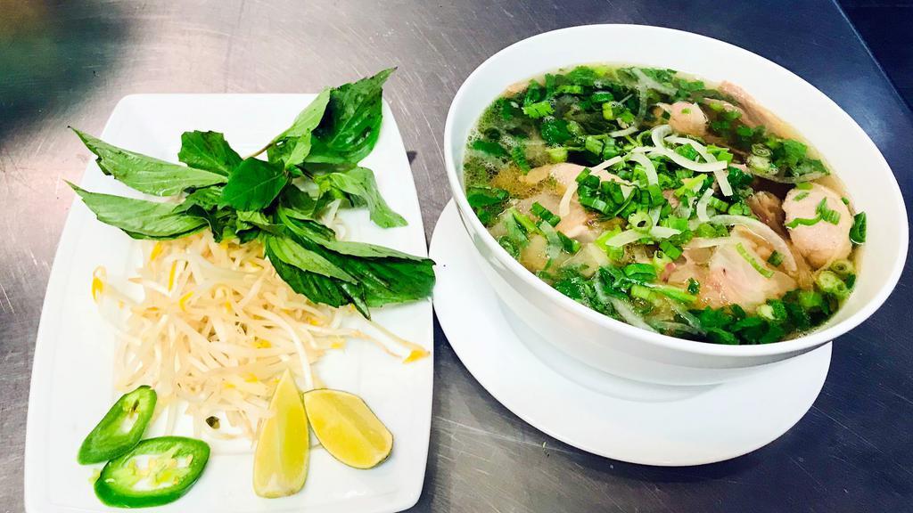 P 1 - Phở Đặt Biệt/ House Combination Pho · Combo beef pho with steak, flank, tendon, brisket served with bean sprout and basil on the side