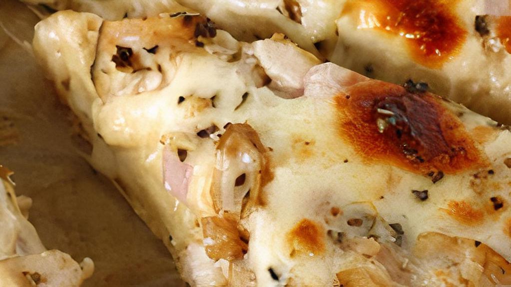Garlic Chicken Specialty Pizza - 15'' - Large · Romio’s signature alfredo sauce with grilled chicken, red onions, roasted red peppers, and mushrooms, topped with mozzarella and parmesan cheese