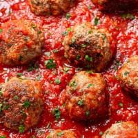 Meatball Dish · Oven-baked meatballs with meat sauce topped with mozzarella and parmesan cheese
