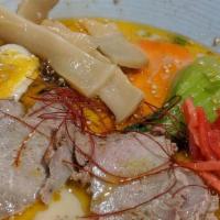 Spicy Shoyu Ramen · (100% CHICKEN BROTH). cha syu pork, fish cake, dark soy sauce, spinach, bean sprout, green o...