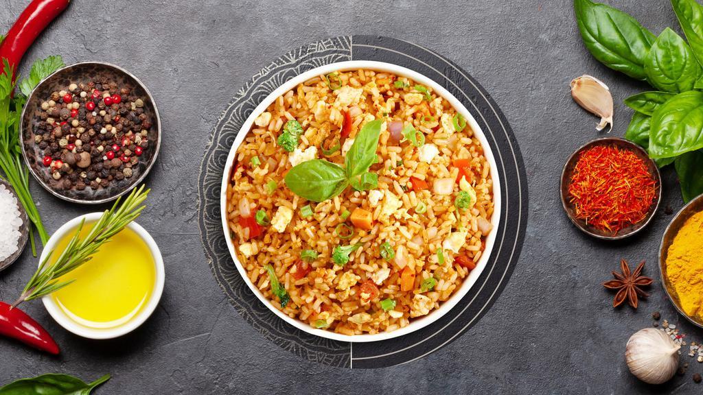 Thai Fried Rice · Jasmine rice, egg, onions, tomatoes, and green onions.