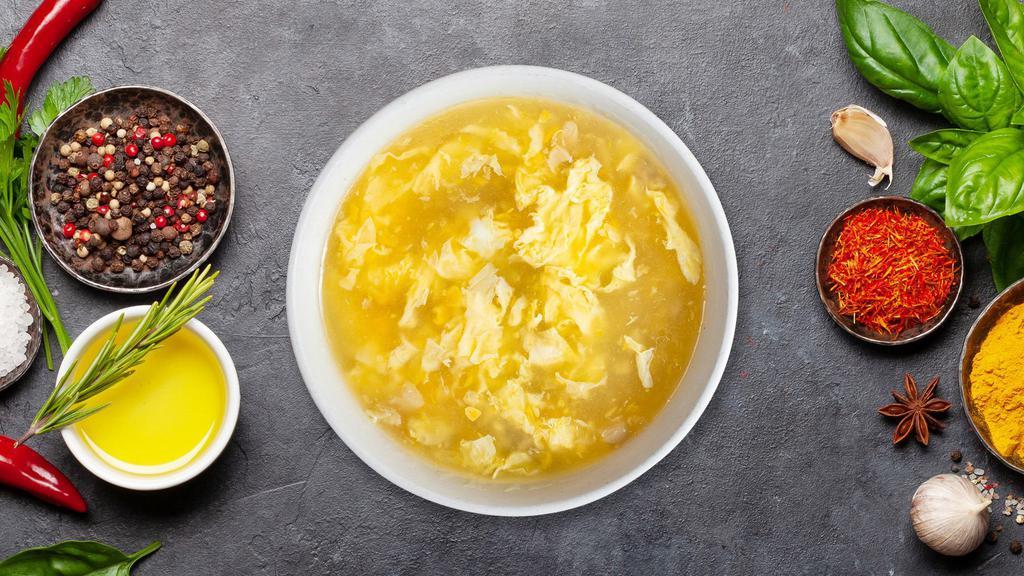 Egg Drop Soup · Classic velvety broth with beaten eggs.