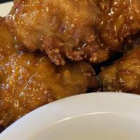 Chicken Wings · Fan favorite! 10 wings deep fried and served in BBQ sauce, buffalo sauce, Honey Garlic sauce...