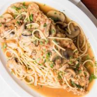 Chicken Marsala · Chicken breast served with mushrooms, onions, and prosciutto and sautéed in a marsala wine s...
