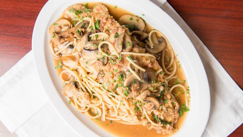 Chicken Marsala · Chicken breast served with mushrooms, onions, and prosciutto and sautéed in a marsala wine sauce.