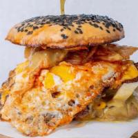Loco Moco Burger · Double smashed patties, Japanese curry mayo, fried egg, pickled white onion, kimchee, steame...