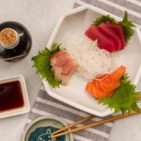 Taste Of Sashimi · Three pieces salmon, three pieces tuna, and three pieces yellow tail.