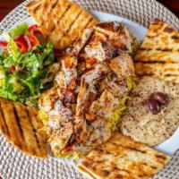 Shawarma Plate · Beef, lamb, or chicken marinated in our Egyptian spices. Topped with hummus, rice, veggie sa...