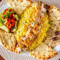 Shish Kabab Plate · Charbroiled beef, lamb, or chicken with hummus, rice, veggie salad, pita bread, garlic, and ...