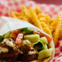 Falafel Sandwich · Crushed garbanzo beans mixed with parsley, cilantro, and spices. Served with hummus, lettuce...