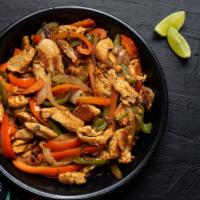 Chicken Fajitas · Delicious marinated chicken sautéed with bell peppers and onions, served on a sizzling platt...