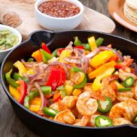 Shrimp Fajitas · Delicious marinated shrimp sautéed with bell peppers and onions, served on a sizzling platte...