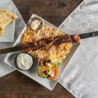 Shish Kabob Plate · Grilled chicken, beef or lamb marinated kabobs charbroiled served with a warm pillowy pita, ...