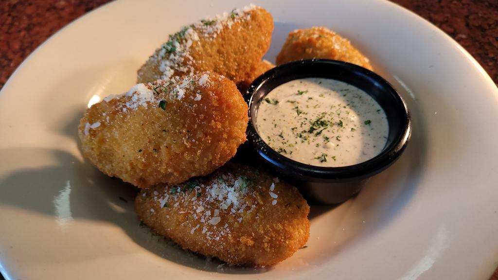 Mac And Cheese Bites · 6 Mac and cheese wedges  filled with macaroni noodle. Mozzarella and parmesan cheese served with a side of ranch
