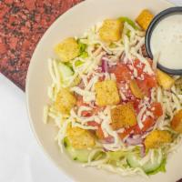 House Salad · Lettuce mix, tomato, onions, cucumbers, mozzarella cheese, and croutons served with your cho...