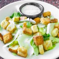 Caesar Salad · Lettuce mix topped with Parmesan, croutons, tomato, and a side of Caesar dressing.