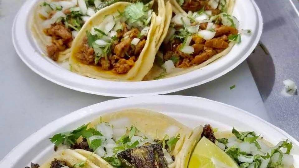 Taco Plate · Tacos served with meat, onions, and cilantro. Served with rice, beans on the side.