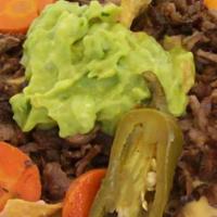 Nachos · Choice of meat, beans, onions, cilantro, tomato, cheese, sour cream, guacamole, and jalapenos.
