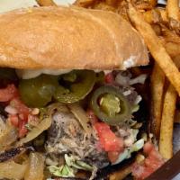 Carnitas Sandwich · Marinated and slow roasted pork served with all of our regular toppings of roasted poblano, ...