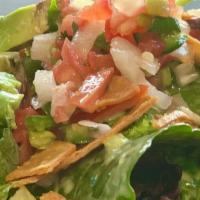 House Salad · Spring mix, cherry tomato, red pepper, tortilla strip, avocado, and mango dressing .