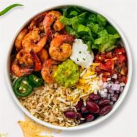 Keep It Shrimple Bowl · Fresh grilled shrimp topped with Romaine lettuce, black beans, cilantro lime rice, sautéed o...