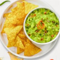 Guac Out Loud & Chips · A heaping scoop of fresh guacamole and warm tortilla chips.