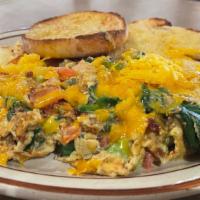 California Scramble · Spinach, tomato, onion, cheddar, bacon, and avocado. Served with your choice of hashbrowns a...