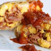 Mom'S Burrito · Mexican blend cheese, scrambled eggs, pork sausage, bacon, and ham all wrapped in a flour to...
