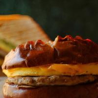 Pretzel Breakfast · Eggs, American cheese, sausage patty, mayo, all pressed together on a delicious pretzel bun.