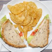 The Gobble Sandwich · Turkey deli meat, Monterey jack cheese, mayo, guac, tomato, romaine lettuce, slightly toaste...