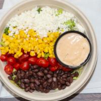 Ay Caramba · Organic quinoa, black beans, corn, cherry tomatoes, topped with feta cheese and a side of ch...