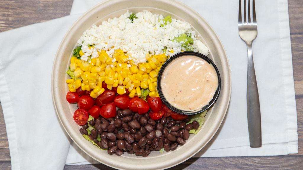 Ay Caramba · Organic quinoa, black beans, corn, cherry tomatoes, topped with feta cheese and a side of chipotle dressing.