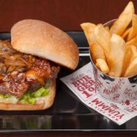 The Southern Charm Burger™ · Mind your manners around this burger glazed with brown sugar and topped with candied bacon, ...