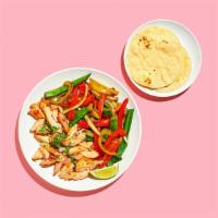 Chicken Fajitas · Chicken fajitas with pepper and onions, shredded cheese, salsa, and rice. Served with flour ...