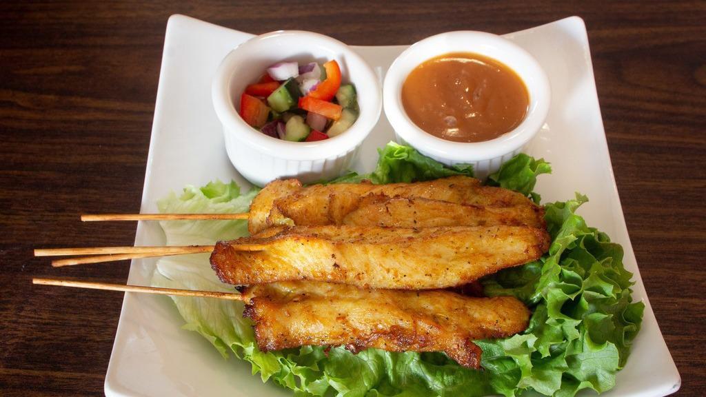 Chicken Satay (4) · Tender chicken breast, marinated and grilled on skewers and served with peanut sauce.