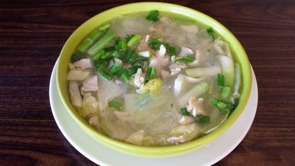 Kang Jeud (Thai Chicken Vegetable) · Homemade broth with fresh Napa cabbage, green onions, Clear thread noodles, and ground chicken.