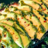 Avada Ricotta · Creamy ricotta, hass avocado, red pepper, housemade cilantro drizzle.