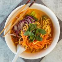 Khao Soi · Traditional Northern Thai curry noodle soup served with chicken, dried chili, pickle cabbage...