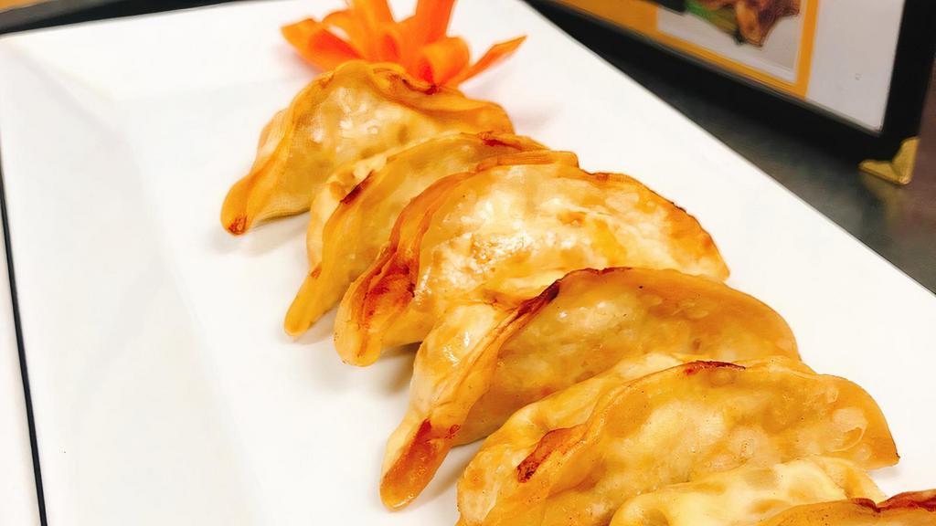 Fried Dumplings (6) · Crispy pork and vegetable dumplings served with homemade sauce.