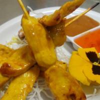 Chicken Satay (5) · Grilled chicken on skewer served with peanut sauce and cucumber sauce.