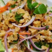 Larb · Minced chicken salad with carrot, mint, cilantro, green and red onion served with lettuce an...