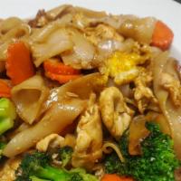 Pad See-Ew · Rice noodles stir fried with egg, broccoli, carrot and baby corn.   Add chicken, beef, shrim...