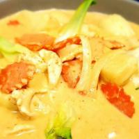 Massaman Curry · Massaman curry paste cooked with white onion, potato and carrot in coconut milk. Add beef, p...